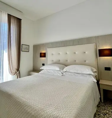 Letto o letti in una camera di Albergo Degli Amici