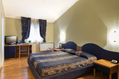Letto o letti in una camera di Hotel Gambara