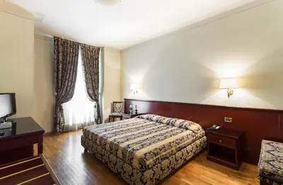 Letto o letti in una camera di Hotel Gambara
