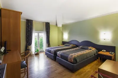Letto o letti in una camera di Hotel Gambara