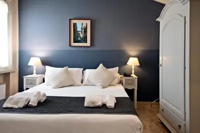 Letto o letti in una camera di Hotel Broletto Mantova - Centro Storico