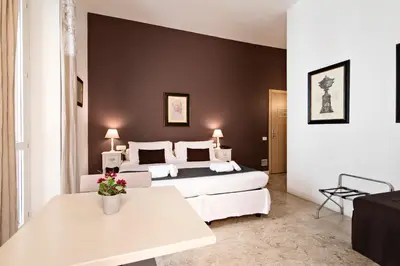 Letto o letti in una camera di Hotel Broletto Mantova - Centro Storico