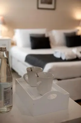 Letto o letti in una camera di Hotel Broletto Mantova - Centro Storico