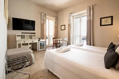 Letto o letti in una camera di Hotel Broletto Mantova - Centro Storico