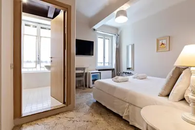 Letto o letti in una camera di Hotel Broletto Mantova - Centro Storico