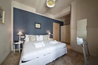 Letto o letti in una camera di Hotel Broletto Mantova - Centro Storico