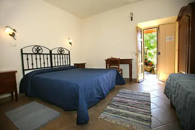 Letto o letti in una camera di B&B Podere Bramapane
