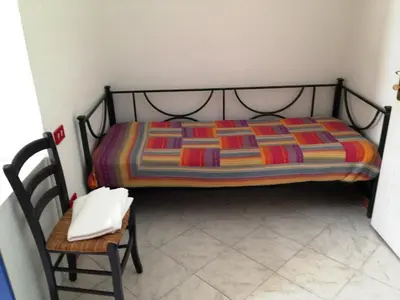 Letto o letti in una camera di Le Conchiglie