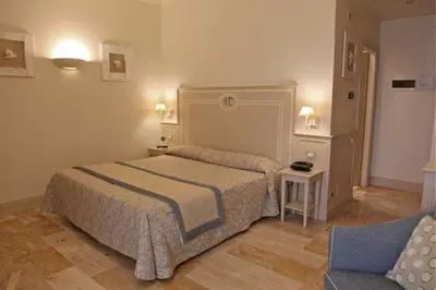 Letto o letti in una camera di Hotel La Colonnina