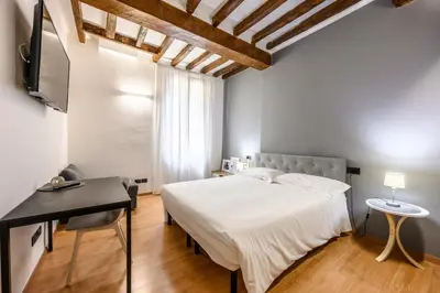 Letto o letti in una camera di Emilia Studios