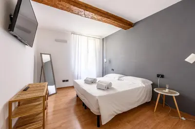 Letto o letti in una camera di Emilia Studios