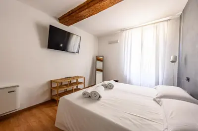 Letto o letti in una camera di Emilia Studios