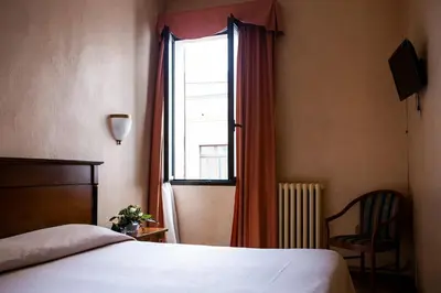 Letto o letti in una camera di Hotel Astor