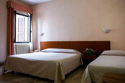 Letto o letti in una camera di Hotel Astor