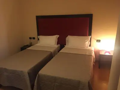 Letto o letti in una camera di Hotel Motel Galaxy Reggio Emilia