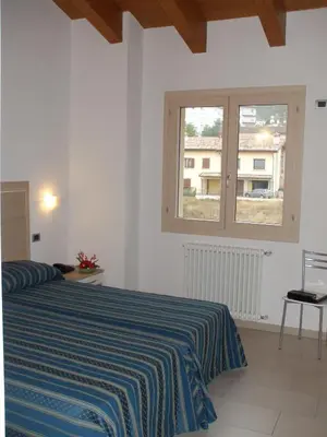 Letto o letti in una camera di Residence Hotel Matilde