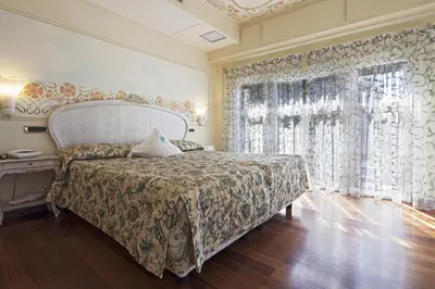 Letto o letti in una camera di Suite Hotel Nettuno