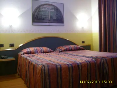 Letto o letti in una camera di Hotel Alexander