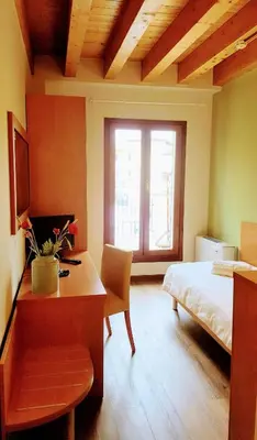 Letto o letti in una camera di Locanda Avanguardia