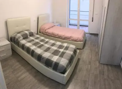 Letto o letti in una camera di M&Y S HOUSE vicino alle spiagge Lavagna