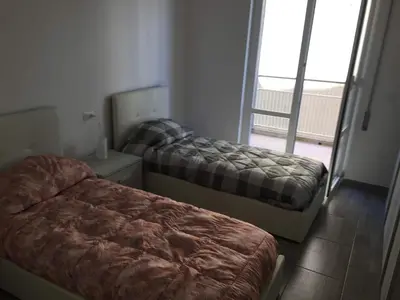 Letto o letti in una camera di M&Y S HOUSE vicino alle spiagge Lavagna