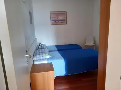 Letto o letti in una camera di azienda agricola zulin casa elena