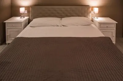 Letto o letti in una camera di L’infinito residence