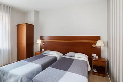 Letto o letti in una camera di Hotel Excelsior Pavia