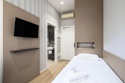 Letto o letti in una camera di Hotel Excelsior Pavia