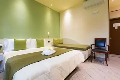 Letto o letti in una camera di Affittacamere Serena