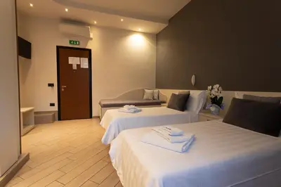 Letto o letti in una camera di Affittacamere Serena