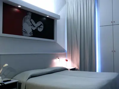 Letto o letti in una camera di Hotel Italia