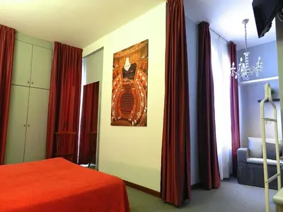 Letto o letti in una camera di Hotel Italia