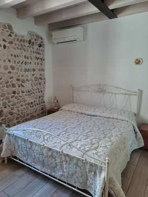 Letto o letti in una camera di La Piazzetta