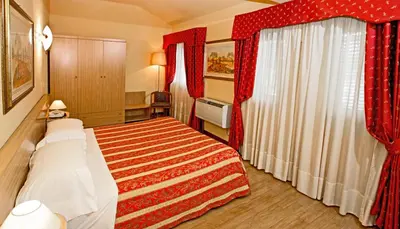 Letto o letti in una camera di Albergo Nazionale