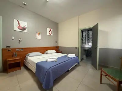 Letto o letti in una camera di La Gritta srl
