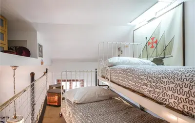 Letto o letti in una camera di Il Cottage