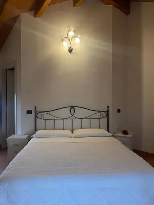 Letto o letti in una camera di B&B Molinetto