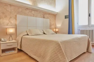 Letto o letti in una camera di Albergo Celeste