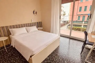 Letto o letti in una camera di Hotel Elisabetta
