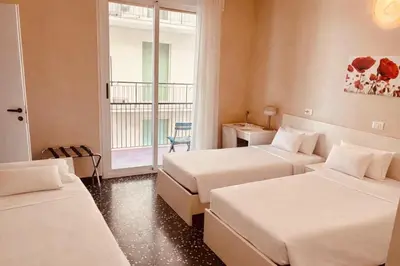 Letto o letti in una camera di Hotel Elisabetta