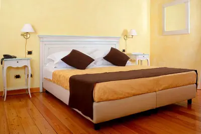 Letto o letti in una camera di Albergo Dimora Storica Antica Hostelleria