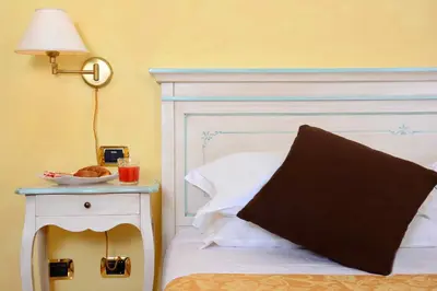 Letto o letti in una camera di Albergo Dimora Storica Antica Hostelleria