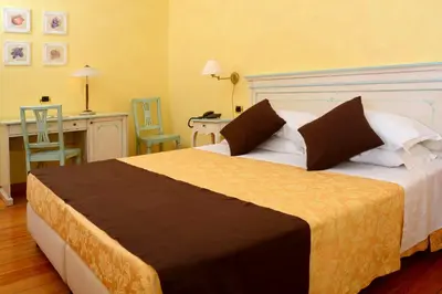 Letto o letti in una camera di Albergo Dimora Storica Antica Hostelleria