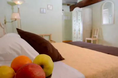 Letto o letti in una camera di Albergo Dimora Storica Antica Hostelleria