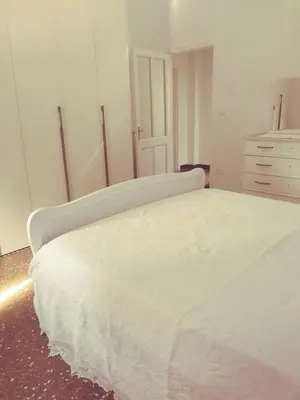 Letto o letti in una camera di Casa Orchidea