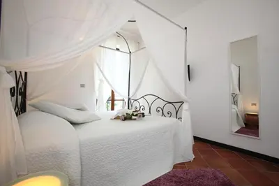 Letto o letti in una camera di Rooms and Breakfast da Carla