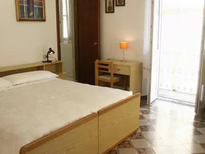 Letto o letti in una camera di Albergo Corona