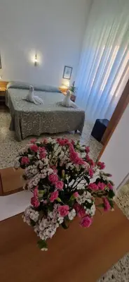 Letto o letti in una camera di Hotel Dora