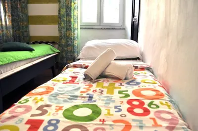 Letto o letti in una camera di Giramondo